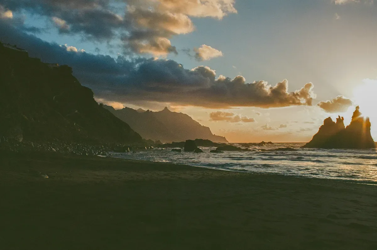 Sunset over a rocky coastline, cover image for What AI Founder Mode means for business